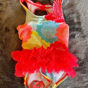 Super cute swimsuit with bottom ruffles size 3-6M with a headband